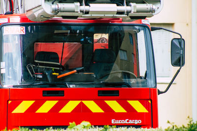 Close-up of red text on car windshield