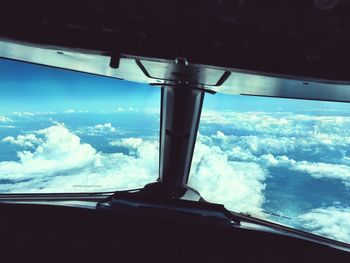 Aerial view of sea seen through airplane window
