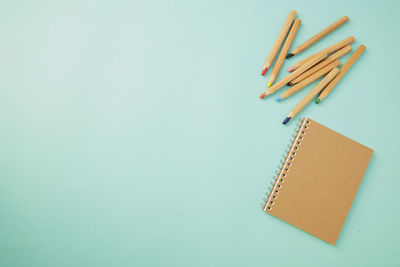 High angle view of books against blue background