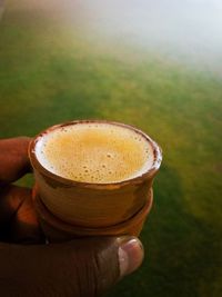 Close-up of hand holding drink