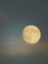 Low angle view of moon against clear sky at night