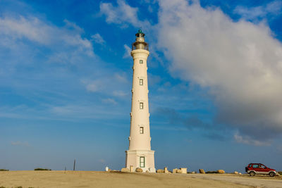 Low angle view of lighthouse against blue sky