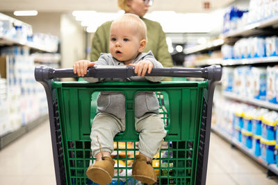 Portrait of cute boy playing with luggage