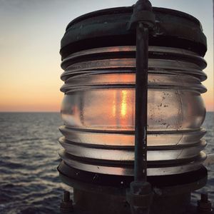 Close-up of sea against sky during sunset