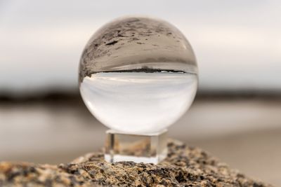 Close-up of water in sea against sky