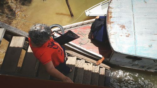 High angle view of woman by umbrella