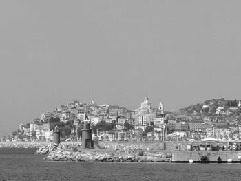 View of sea against buildings in imperia city