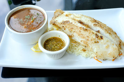 High angle view of serving food in plate on table