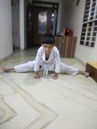 Portrait of boy sitting at home