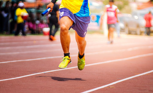 Low section of man running