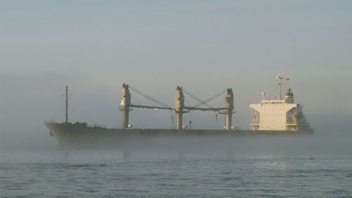 View of ship in sea against sky