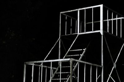 Staircase against sky at night