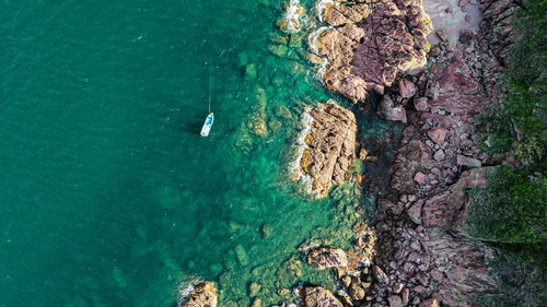 High angle view of rock formation in sea