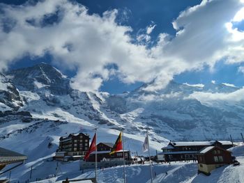 Scenic view of snowcapped mountains against sky