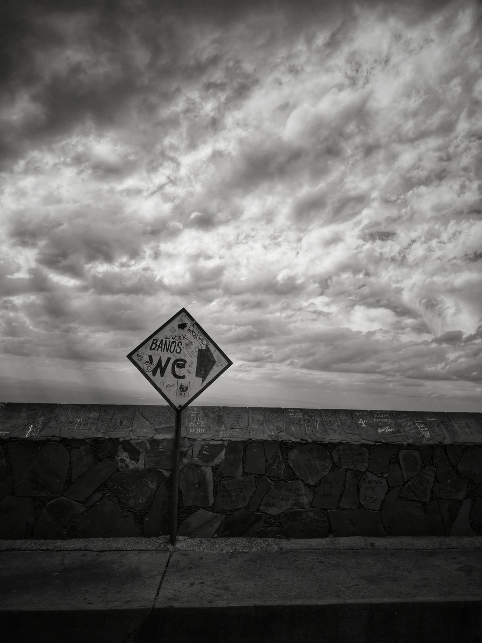 INFORMATION SIGN AGAINST WALL