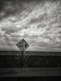 Road sign against the sky