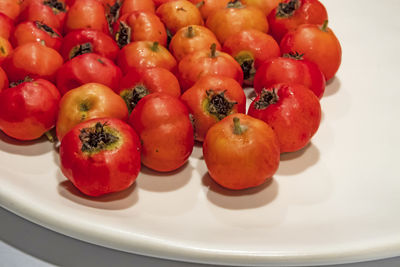 High angle view of tomatoes in plate on table