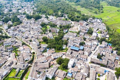 High angle view of street amidst buildings in town
