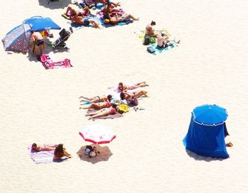 High angle view of people at beach during sunny day