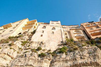 Low angle view of building against blue sky