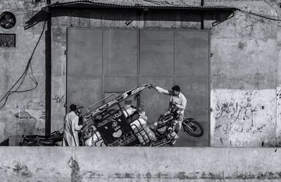 Bicycles against built structure