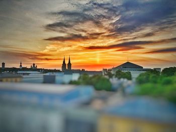 Scenic view of buildings against sky during sunset