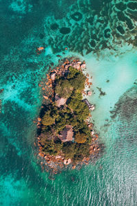 High angle view of rock formation in sea