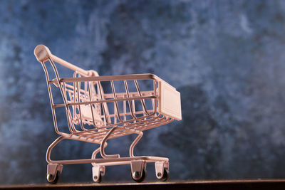 Close-up of shopping cart on table