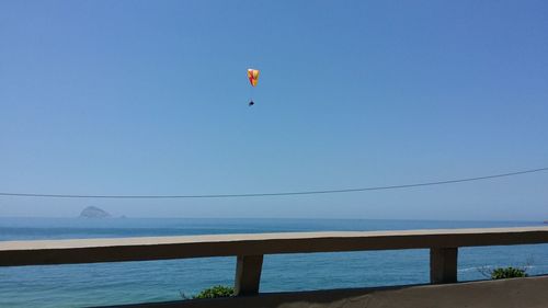 Low angle view of parachute against sky