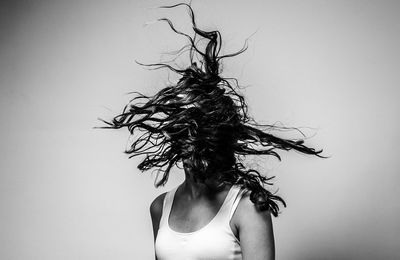 Close-up of woman over white background