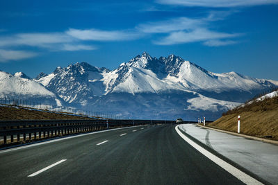 View of snowcapped mountain against cloudy sky