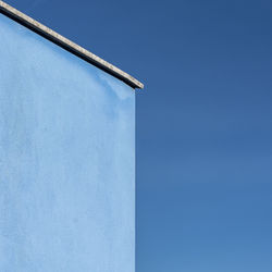 Low angle view of building against blue sky