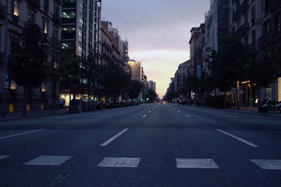 View of city street and buildings in barcelona at afternoon
