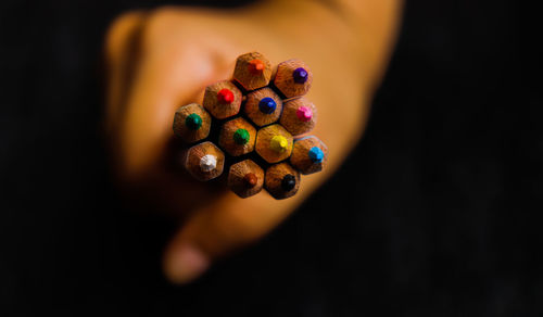 Directly above shot of woman holding multi colored candies