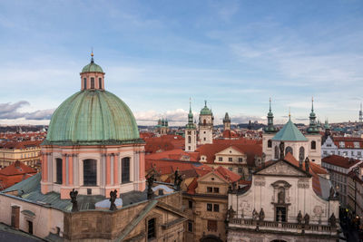 Cathedral by buildings in city