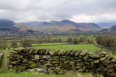 Scenic view of landscape and mountains against sky