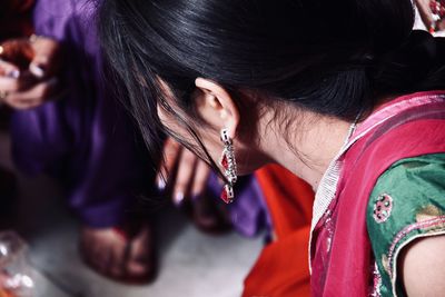 Close-up of woman wearing earring