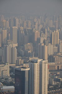 High angle view of buildings in city against sky