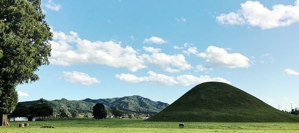 Scenic view of landscape against cloudy sky