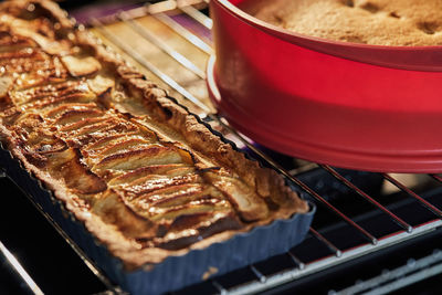 Apple pie and grape pie in the oven after baking