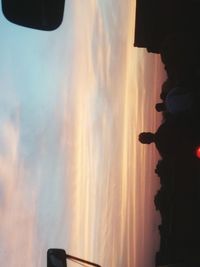 Silhouette of woman at sunset