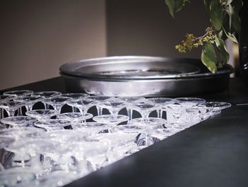 Close-up of upside down wineglasses on table