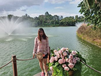 Rear view of woman looking at waterfall