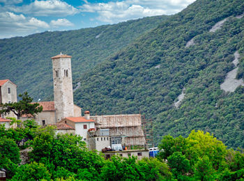 Buildings against mountain range