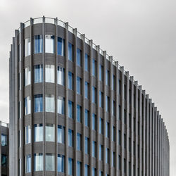 Low angle view of modern building against clear sky