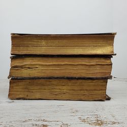 Close-up of books on table against white background