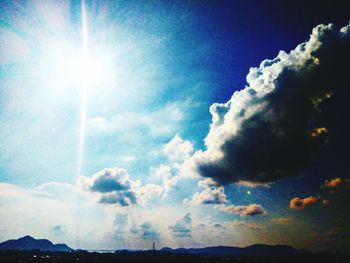 Scenic view of landscape against cloudy sky