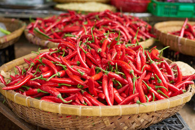 Close-up of red chili peppers in basket