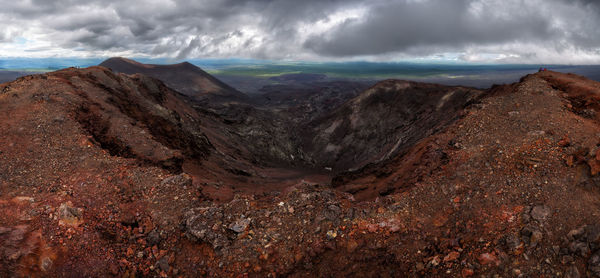 Scenic view of arid landscape against sky