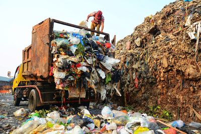 Garbage on metal structure against sky